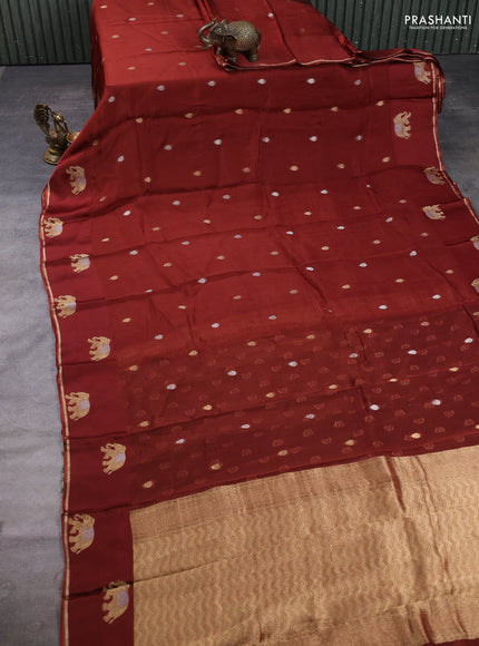 Art kota silk saree brown and green with allover silver & zari woven buttas and elephant design zari woven border