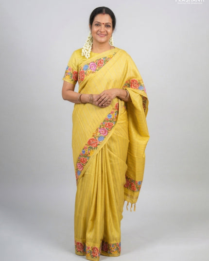 Semi tussar saree yellow with allover zari stripe pattern and floral embroidery border