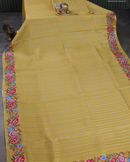 Semi tussar saree yellow with allover zari stripe pattern and floral embroidery border