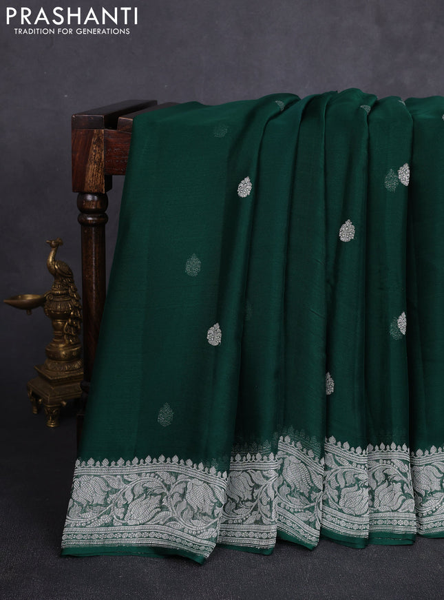 Banarasi chiffon saree bottle green with allover silver zari woven buttas and silver zari woven floral border