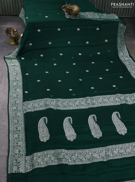 Banarasi chiffon saree bottle green with allover silver zari woven buttas and silver zari woven floral border