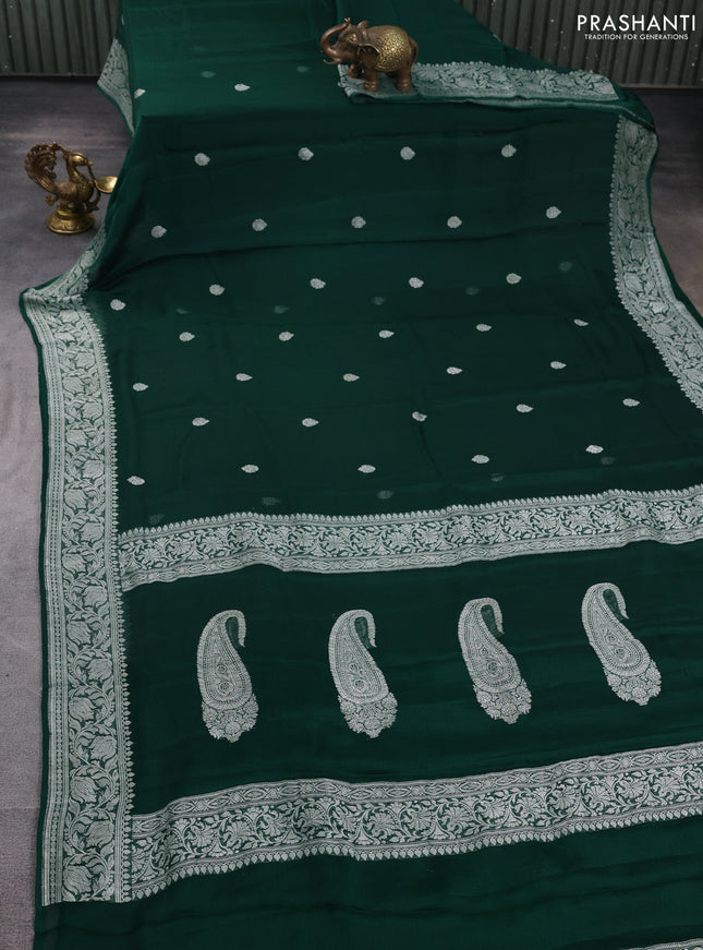 Banarasi chiffon saree bottle green with allover silver zari woven buttas and silver zari woven floral border
