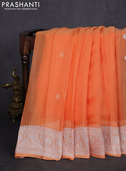 Banarasi chiffon saree light orange with allover silver zari woven buttas and silver zari woven floral border