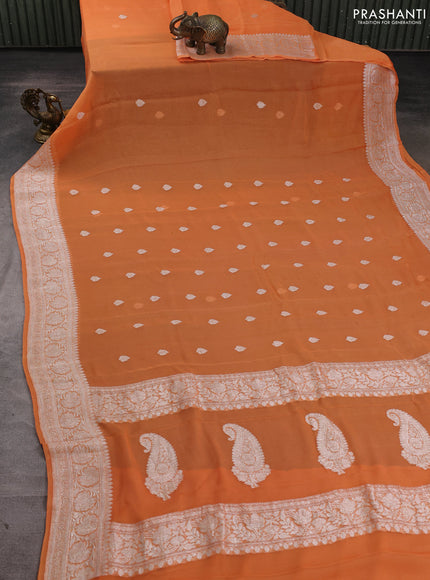 Banarasi chiffon saree light orange with allover silver zari woven buttas and silver zari woven floral border