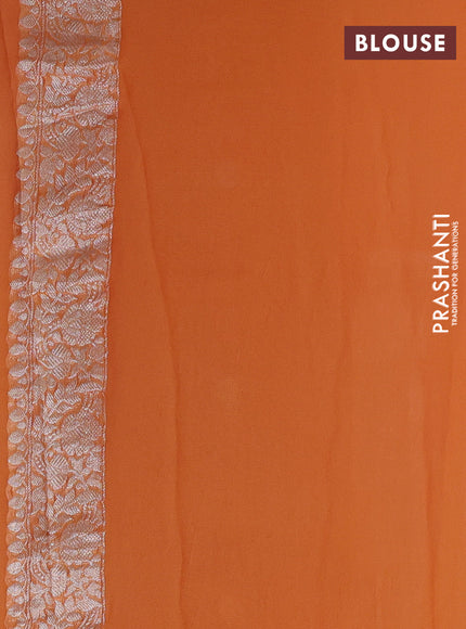 Banarasi chiffon saree light orange with allover silver zari woven buttas and silver zari woven floral border