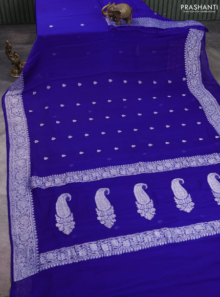 Banarasi chiffon saree royal blue with allover silver zari woven buttas and silver zari woven floral border