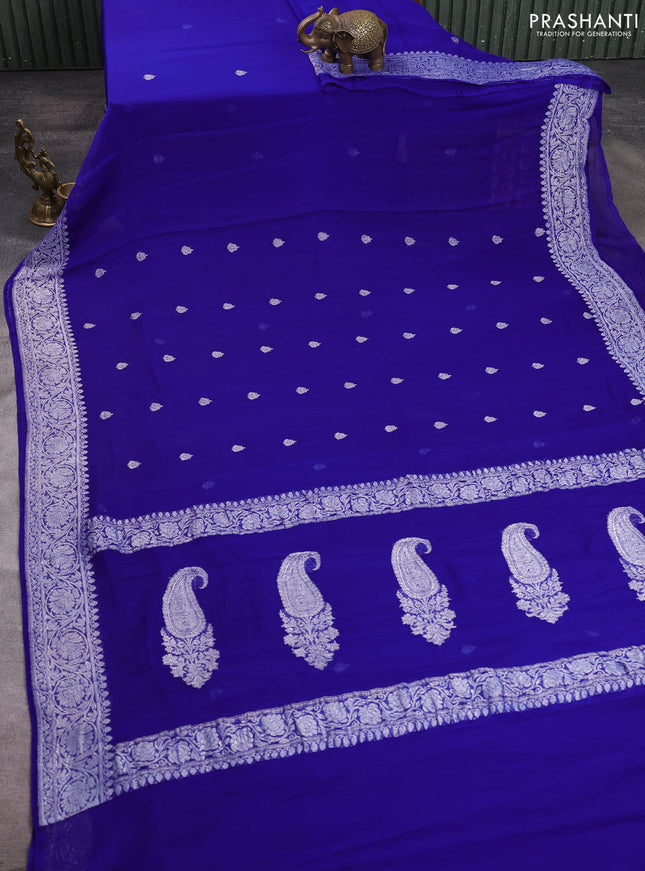 Banarasi chiffon saree royal blue with allover silver zari woven buttas and silver zari woven floral border