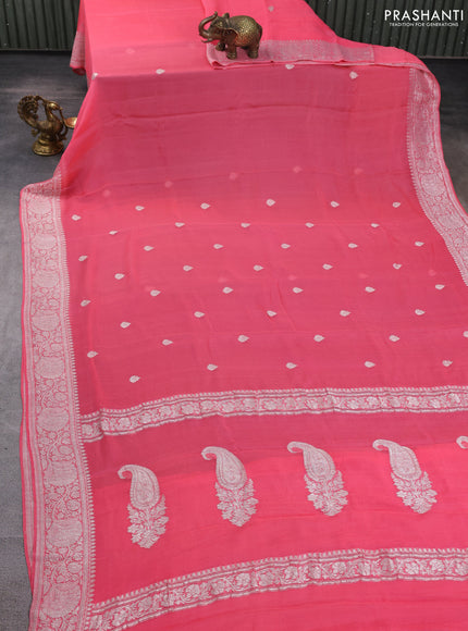 Banarasi chiffon saree peach pink with allover silver zari woven buttas and silver zari woven floral border
