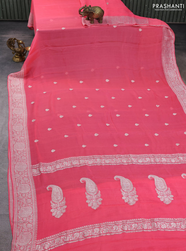 Banarasi chiffon saree peach pink with allover silver zari woven buttas and silver zari woven floral border