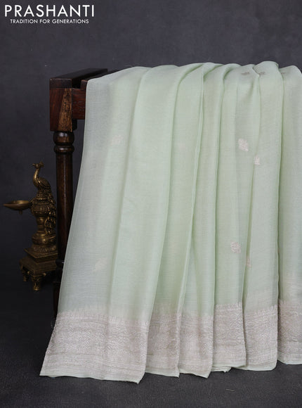 Banarasi chiffon saree mild pista green with allover silver zari woven buttas and silver zari woven floral border