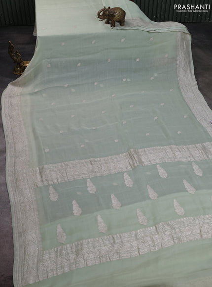 Banarasi chiffon saree mild pista green with allover silver zari woven buttas and silver zari woven floral border