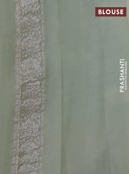 Banarasi chiffon saree mild pista green with allover silver zari woven buttas and silver zari woven floral border