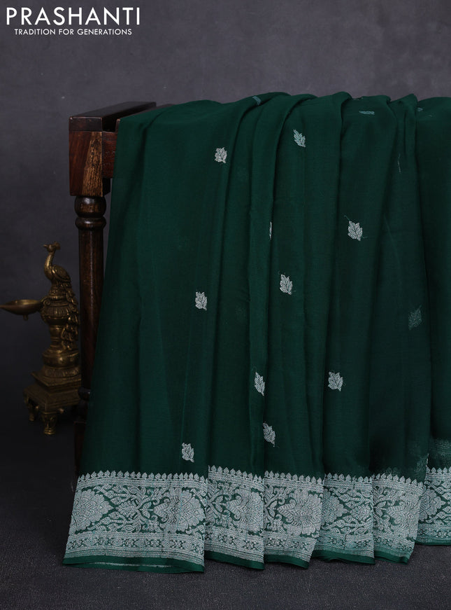 Banarasi chiffon saree bottle green with allover silver zari woven buttas and silver zari woven floral border