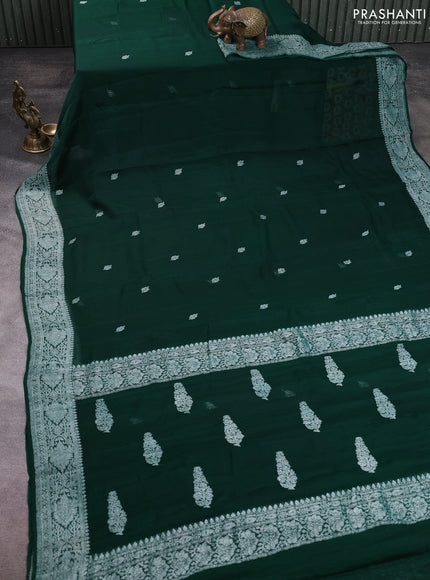 Banarasi chiffon saree bottle green with allover silver zari woven buttas and silver zari woven floral border