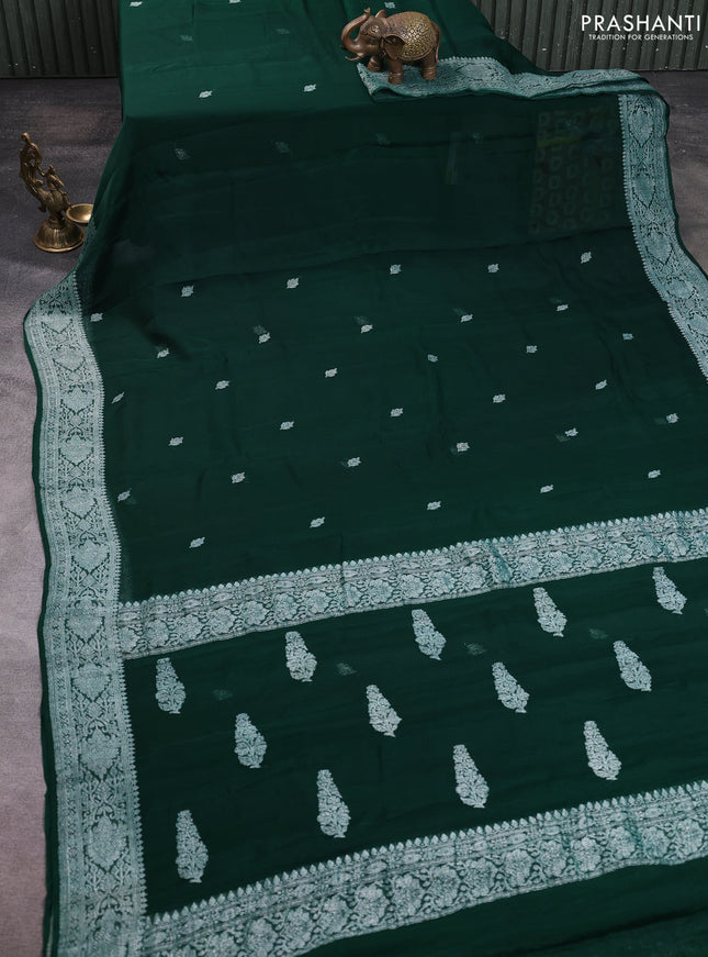 Banarasi chiffon saree bottle green with allover silver zari woven buttas and silver zari woven floral border