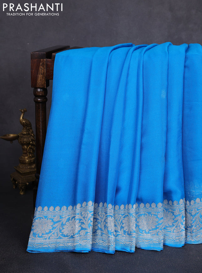 Banarasi chiffon saree cs blue with allover silver zari woven buttas and silver zari woven floral border