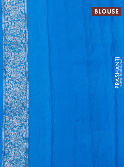 Banarasi chiffon saree cs blue with allover silver zari woven buttas and silver zari woven floral border