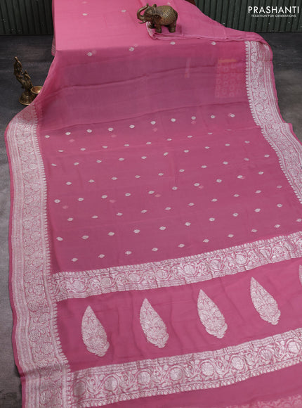 Banarasi chiffon saree peach pink with allover silver zari woven buttas and silver zari woven floral border
