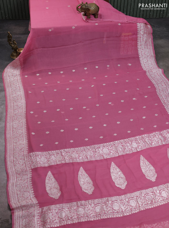 Banarasi chiffon saree peach pink with allover silver zari woven buttas and silver zari woven floral border