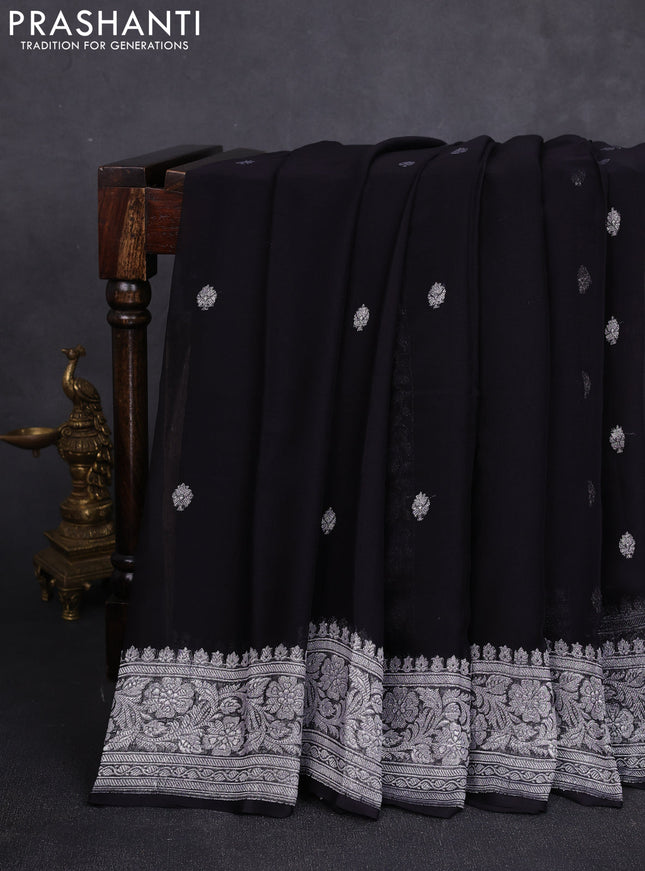 Banarasi chiffon saree black with allover silver zari woven buttas and silver zari woven floral border