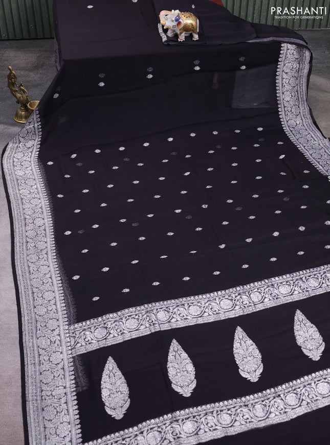 Banarasi chiffon saree black with allover silver zari woven buttas and silver zari woven floral border