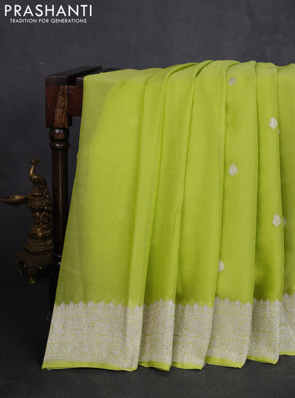 Banarasi chiffon saree lime green with allover silver zari woven buttas and silver zari woven floral border