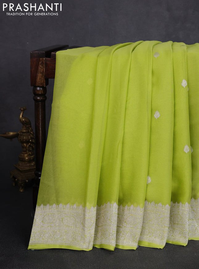 Banarasi chiffon saree lime green with allover silver zari woven buttas and silver zari woven floral border