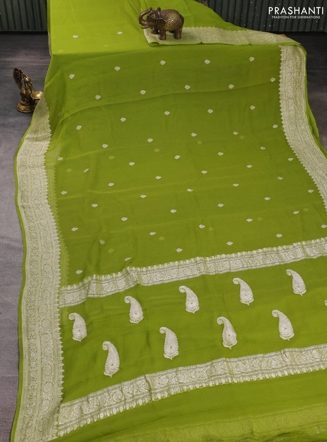 Banarasi chiffon saree lime green with allover silver zari woven buttas and silver zari woven floral border