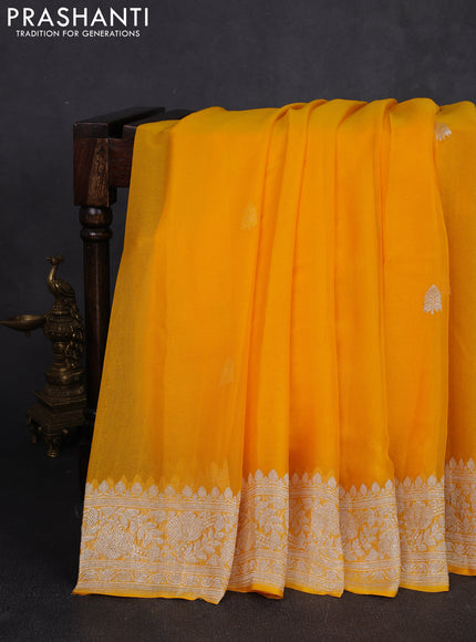 Banarasi chiffon saree yellow shade with allover silver zari woven buttas and silver zari woven floral border
