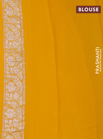 Banarasi chiffon saree yellow shade with allover silver zari woven buttas and silver zari woven floral border