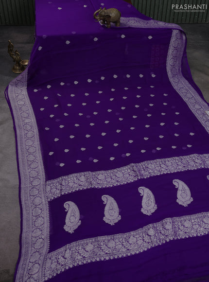 Banarasi chiffon saree violet with allover silver zari woven buttas and silver zari woven floral border