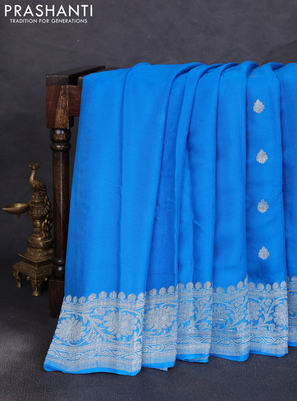 Banarasi chiffon saree cs blue with allover silver zari woven buttas and silver zari woven floral border
