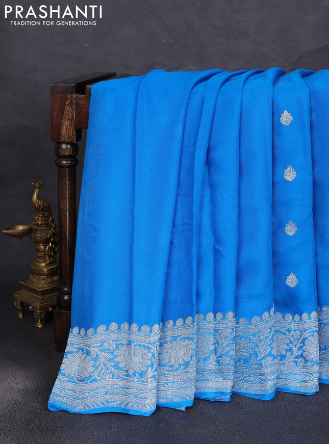 Banarasi chiffon saree cs blue with allover silver zari woven buttas and silver zari woven floral border