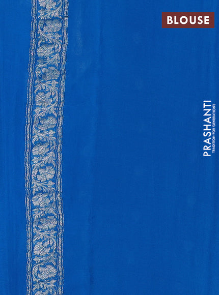 Banarasi chiffon saree cs blue with allover silver zari woven buttas and silver zari woven floral border