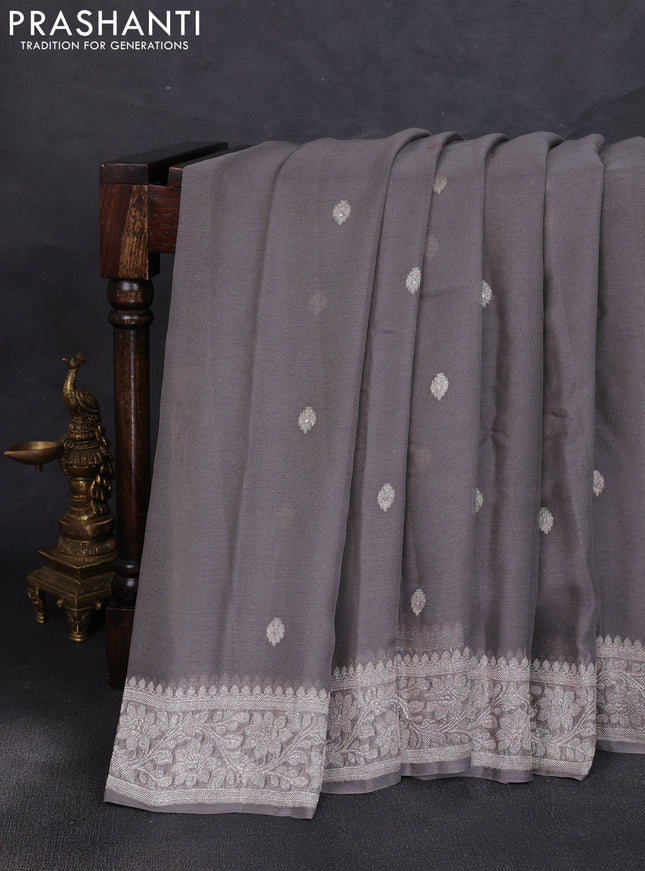 Banarasi chiffon saree grey shade with allover silver zari woven buttas and silver zari woven floral border