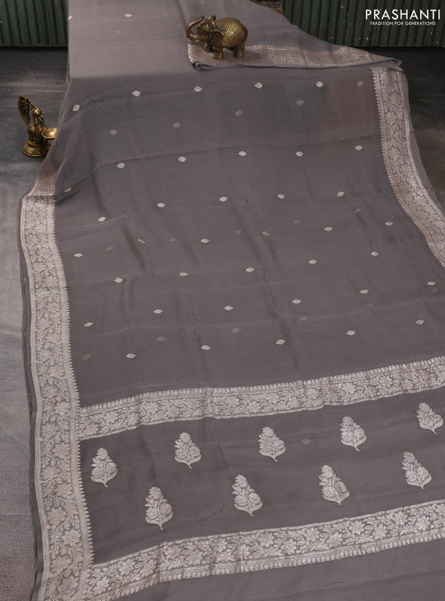 Banarasi chiffon saree grey shade with allover silver zari woven buttas and silver zari woven floral border