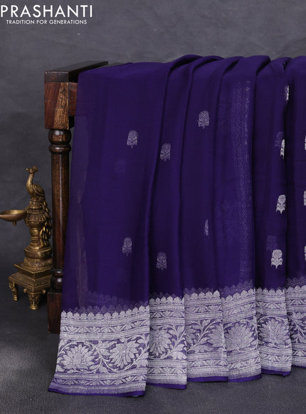 Banarasi chiffon saree navy blue with allover silver zari woven buttas and silver zari woven floral border