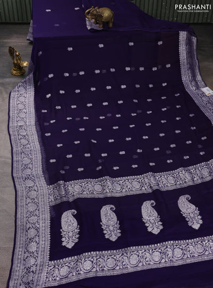 Banarasi chiffon saree navy blue with allover silver zari woven buttas and silver zari woven floral border