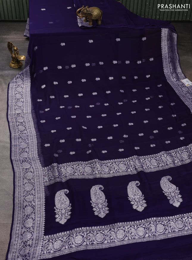 Banarasi chiffon saree navy blue with allover silver zari woven buttas and silver zari woven floral border