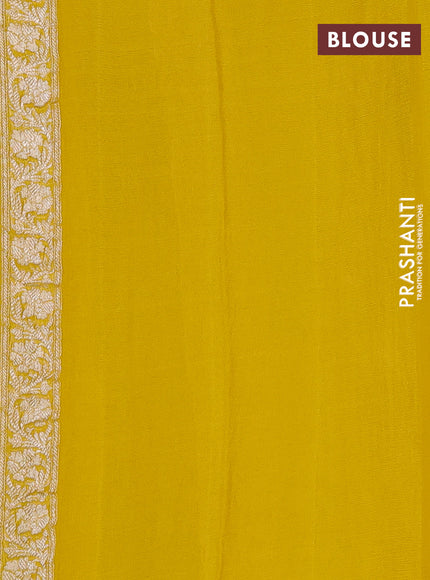 Banarasi chiffon saree yellow shade with allover silver zari woven buttas and silver zari woven floral border
