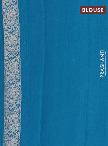 Banarasi chiffon saree teal blue with allover silver zari woven buttas and silver zari woven floral border