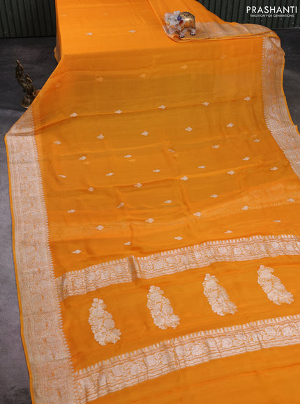 Banarasi chiffon saree mango yellow with allover silver zari woven buttas and silver zari woven floral border