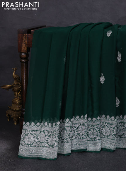 Banarasi chiffon saree bottle green with allover silver zari woven buttas and silver zari woven floral border