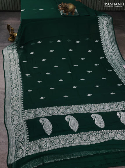 Banarasi chiffon saree bottle green with allover silver zari woven buttas and silver zari woven floral border