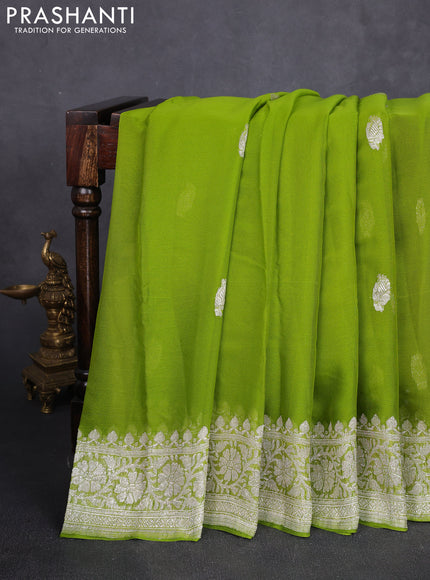 Banarasi chiffon saree lime green with allover silver zari woven buttas and silver zari woven floral border