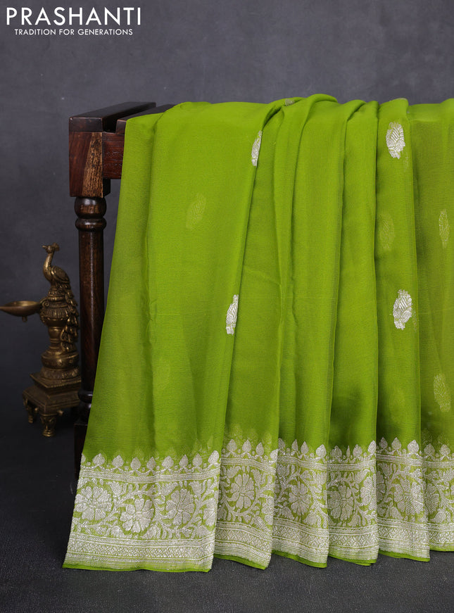 Banarasi chiffon saree lime green with allover silver zari woven buttas and silver zari woven floral border