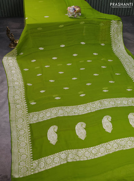 Banarasi chiffon saree lime green with allover silver zari woven buttas and silver zari woven floral border