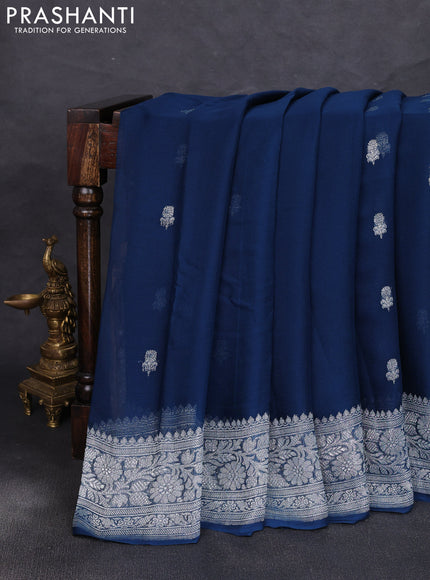 Banarasi chiffon saree peacock green with allover silver zari woven buttas and silver zari woven floral border