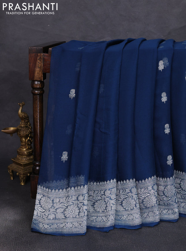 Banarasi chiffon saree peacock green with allover silver zari woven buttas and silver zari woven floral border