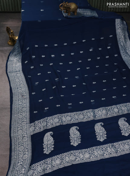 Banarasi chiffon saree peacock green with allover silver zari woven buttas and silver zari woven floral border